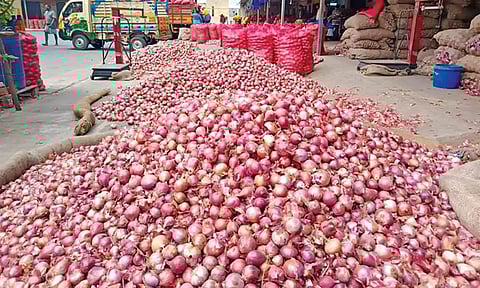 The piled up stock of onions at a market&nbsp;
