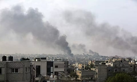 Smoke rises following Israeli strikes during an Israeli military operation in Rafah (Reuters)