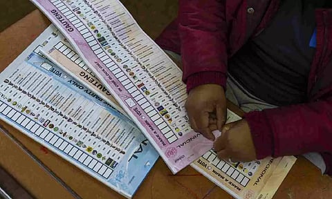 An election official prepares the ballot for the general elections in Soweta, South Africa (AP)