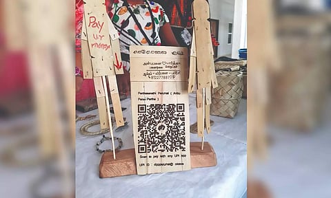 QR code carved on palm wood was one of the exhibits at the venue