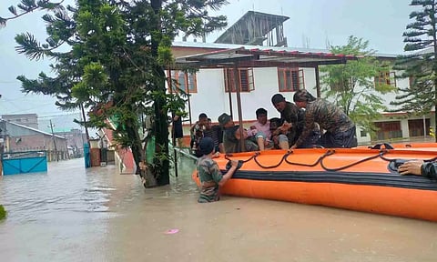 Assam Rifles personnel with others during a rescue and relief operation (PTI)&nbsp;