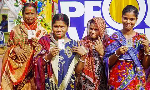Voters pose for pictures after casting votes for the last phase of Lok Sabha elections (PTI)
