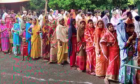 A voter shows her finger marked with indelible ink after casting vote for the last phase of Lok Sabha polls at the world's highest polling station, in Tashigang (PTI)