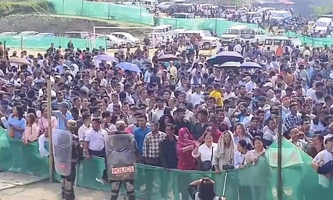 People gather outside a counting centre as Sikkim Krantikari Morcha (SKM) leads in the Assembly polls (PTI)