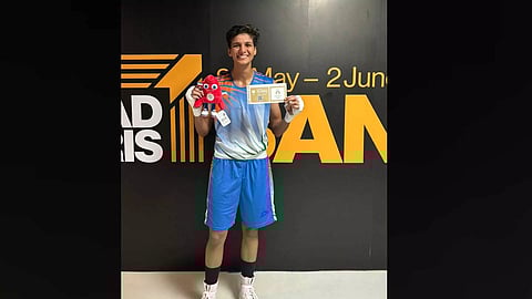 Jasmine poses with her ticket to Paris after the match