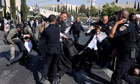 Security forces operate as Ultra-Orthodox Jewish men protest after Israel's Supreme Court convened to discuss petitions to change government policy&nbsp;