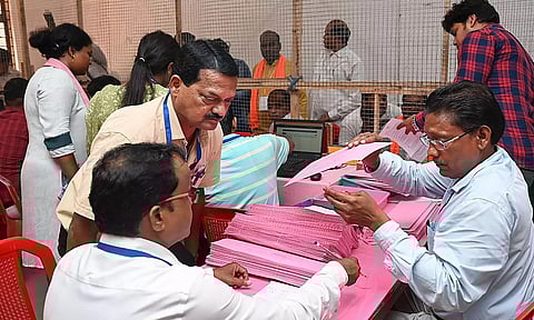 Bhubaneswar: Poll officials at a counting centre during counting of votes for Lok Sabha elections (PTI)
