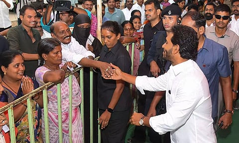 Andhra Pradesh Chief Minister YS Jagan Mohan Reddy meets people as he arrives to cast his vote during the fourth phase of Lok Sabha elections (PTI)
