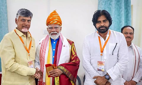 Prime Minister Narendra Modi being greeted by TDP President N Chandrababu Naidu and Jana Sena Party president K Pawan Kalyan (PTI)