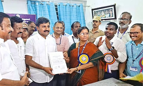 Perambalur candidate Arun Nehru receiving the winner’s certificate from Returning Officer K Karpagam, on Tuesday