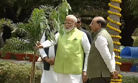 Prime Minister Narendra Modi with Delhi Lt. Governor Vinai Kumar Saxena plants a Peepal sapling on World Environment Day at the Buddha Jayanti Park, in New Delhi (PTI)
