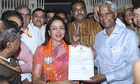 BJP leader and candidate from Mathura constituency Hema Malini receives certificate after winning the Lok Sabha elections, in Mathura (PTI)