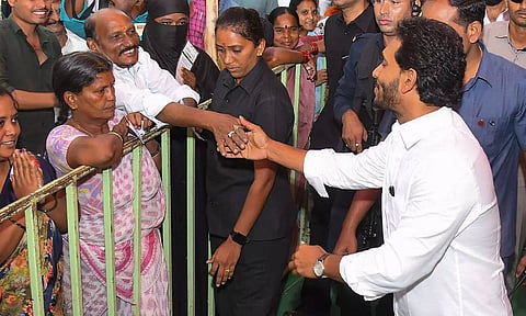 Andhra Pradesh Chief Minister YS Jagan Mohan Reddy meets people as he arrives to cast his vote during the fourth phase of Lok Sabha elections (PTI)