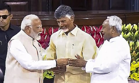 Senior BJP leader Narendra Modi with TDP chief N. Chandrababu Naidu and Bihar CM and JD(U) leader Nitish Kumar (Photo Credit: PTI)