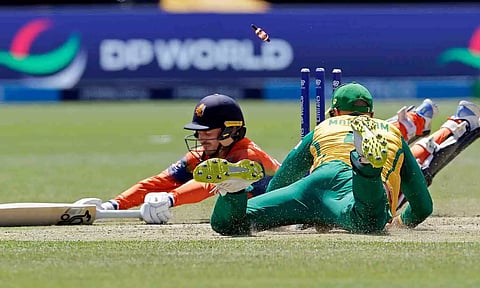 &nbsp;Captain Scott Edwards of the Netherlands dives but is run out for a wicket by South Africa's captain Aiden Markram during the match (PTI)