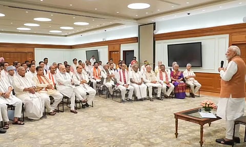 Prime Minister-designate Narendra Modi with NDA leaders during an interaction over tea (PTI)