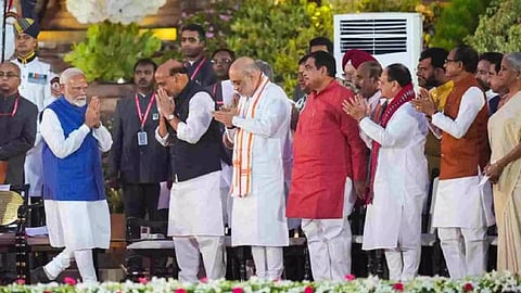 Prime Minister Narendra Modi greets BJP MPs and others at the swearing-in ceremony of the new Union government in New Delhi on June 9, 2024. (PTI)