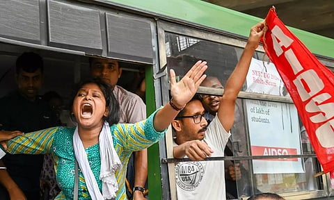 &nbsp;Detained members of AIDSO shout slogans during their protest against the alleged irregularities in NEET-UG entrance exam result-2024 (PTI)&nbsp;