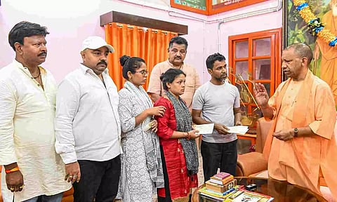 &nbsp;Uttar Pradesh Chief Minister Yogi Adityanath meets the family of an injured victim of Jammu terrorist attack (PTI)