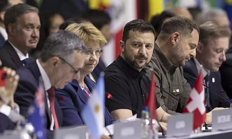 Ukrainian President Volodymyr Zelenskyy, center, attends the plenary session during the Summit on peace in Ukraine