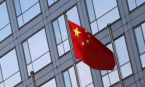 A Chinese flag flutters outside the China Securities Regulatory Commission building

Read more at: https://www.deccanherald.com/world/chinese-communist-partys-former-tibet-chief-under-investigation-for-corruption-3069835
