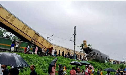 Locals gather after a collision between the Kanchanjungha Express and a goods train, near Rangapani railway station (PTI)