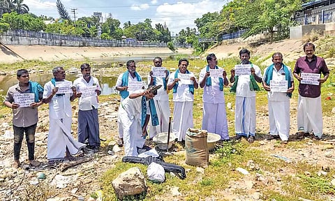 Farmers protest standing in a dry GA canal in Thanjavur