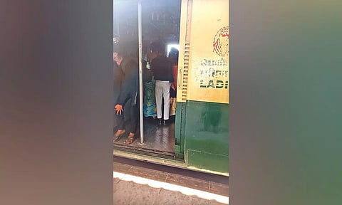 Men travelling in a ladies’ compartment on an EMU
