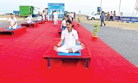 Minister of State for Defence Sanjay Seth during the special yoga session at Dhanushkodi on Friday