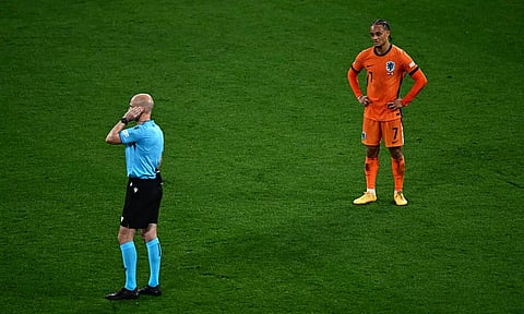 Xavi Simons, who’s goal was called off due to obstruction looks on as referee Anthony Taylor (L) waits for a VAR review decision&nbsp;
