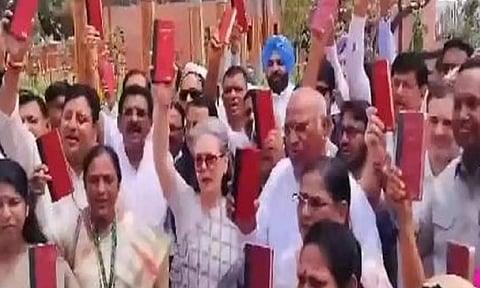 INDIA bloc leaders protest holding copy of Constitution in Parliament premises (ANI)