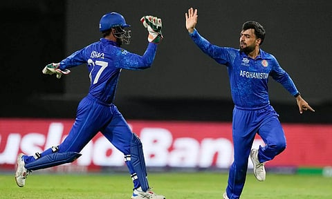 Afghanistan captain Rashid Khan celebrates a wicket