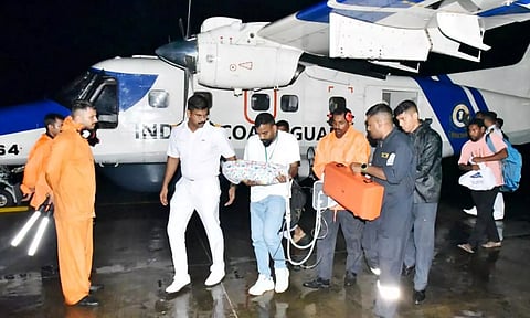 Indian Navy and Indian Coast Guard personnel carry out medical evacuation of four critically ill patients from Agatti Island, Lakshadweep (PTI)