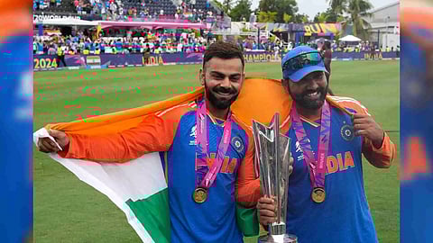 &nbsp;India's Virat Kohli, left, and captain Rohit Sharma pose with the winners trophy after defeating South Africa in the ICC Men's T20 World Cup final cricket match at Kensington Oval in Bridgetown, Barbados, Saturday, June 29, 2024 (Photo/PTI)