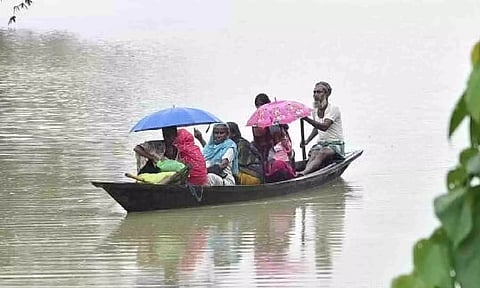 Villagers move to a safer place from a flood affected area, in Morigaon district (PTI)