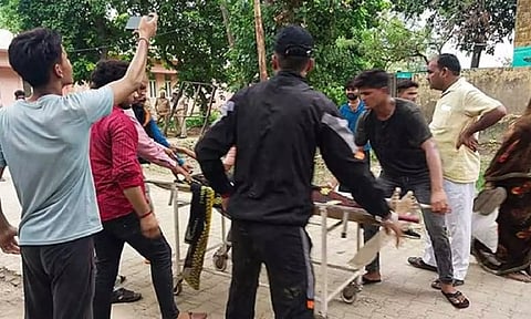 An injured being taken to the hospital after a stampede broke out at a religious gathering, in Hathras district, Tuesday, July 2, 2024. (PTI Photo)