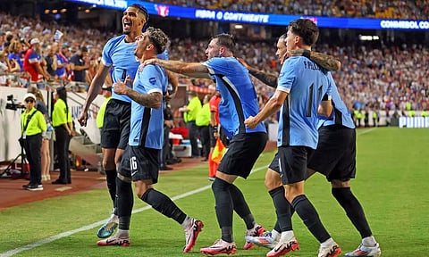 Uruguay players celebrate after taking the lead against USA