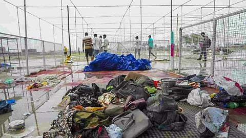 Bags and other belongings lying at the scene a day after a massive stampede that took place during a 'satsang' (religious congregation), in Sikandara Rao area in Hathras district (Photo/PTI)