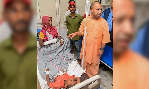 UP Chief Minister Yogi Adityanath meets victims of the Hathras stampede, in Hathras (PTI)