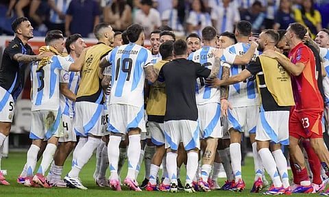 Players of Argentina celebrate defeating Ecuador in a penalty shootout in a Copa America Quarterfinal soccer match in Houston (AP)