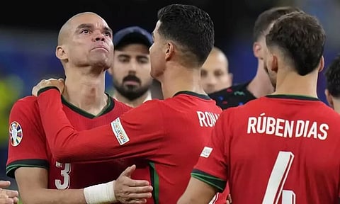 Portugal's Cristiano Ronaldo, second left, embraces Pepe at the end of a quarter final match against France at the Euro 2024 (AP)