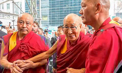 Tibetan spiritual leader Dalai Lama being welcomed by members of the Tibetan community (PTI)