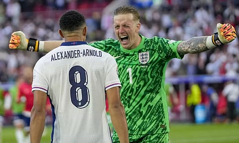 England's goalkeeper Jordan pickford celebrates with Trent Alexander-Arnold (AP)