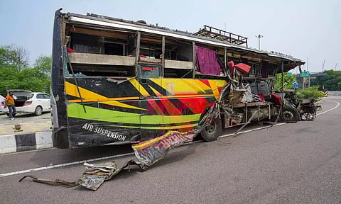 Mangled remains of a bus lies on a road after an accident, in Unnao district (PTI)