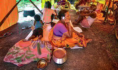 &nbsp;Residents of a flood affected area take refuge in a makeshift shelter, at Kaliabor, in Nagaon district (PTI)