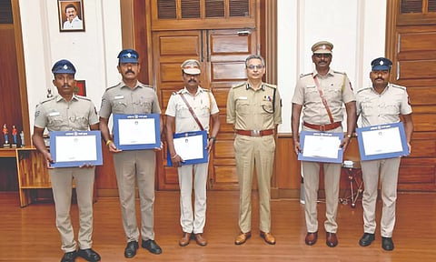DGP felicitating the Thiruppavanam police team with certificates on Sunday