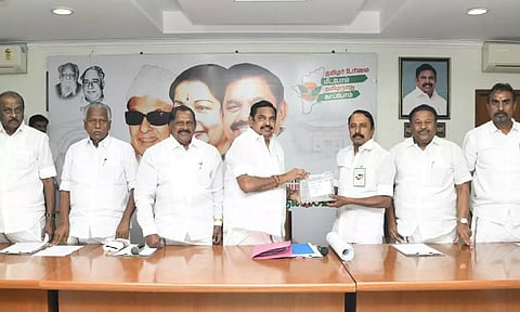 AIADMK general secretary Edappadi K Palaniswami handing over membership cards for Erode district to former minister KA Sengottaiyan in Chennai on Thursday