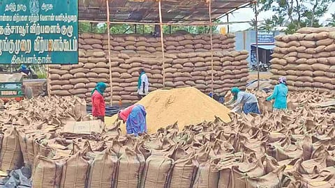 Procured paddy kept in open spaces in a Thanjavur DPC on Monday