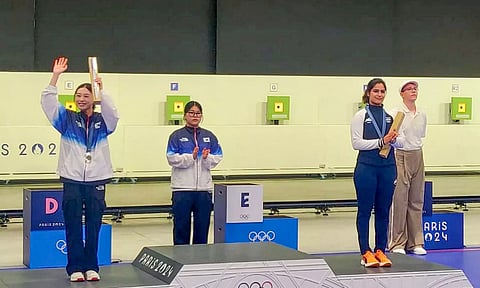 Gold Medallist Koreas Jin Ye Oh with her silver medallist compatriot Kim Yeji and bronze medallist India's Manu Bhaker during the presentation ceremony (PTI)