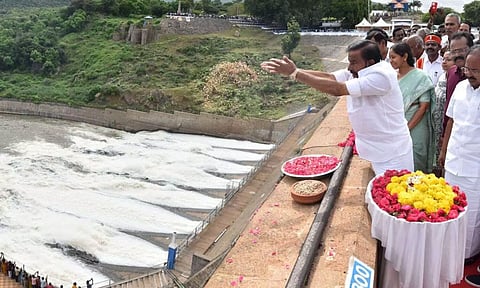 Minister for Municipal Administration, Urban and Water Supply KN Nehru showers flower petals on releasing water from the Mettur dam.